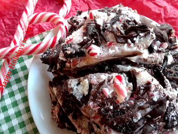White Chocolate Candy Cane Oreo Bark on plate with candy canes